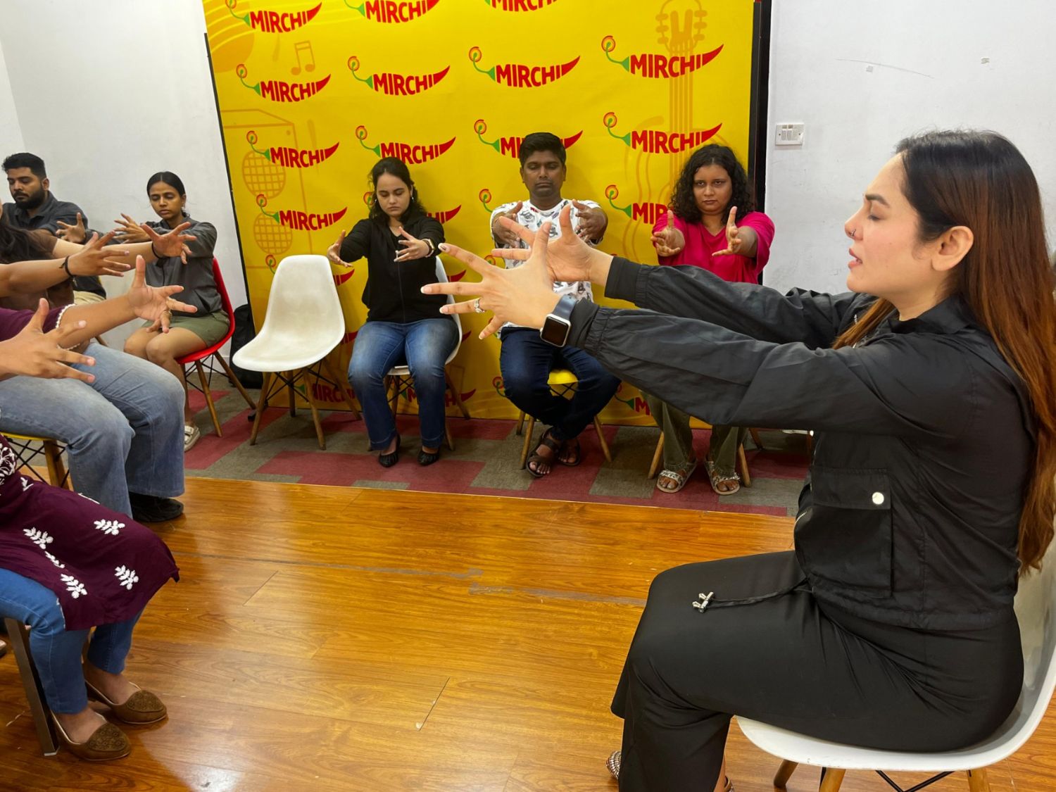 Participants seated in a circle during a guided relaxation exercise led by Vibha Jain in Mumbai